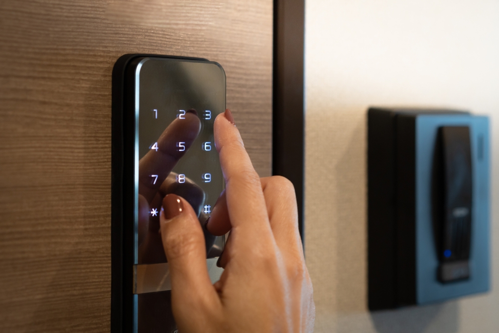 A frustrated homeowner struggling with a faulty smart lock.